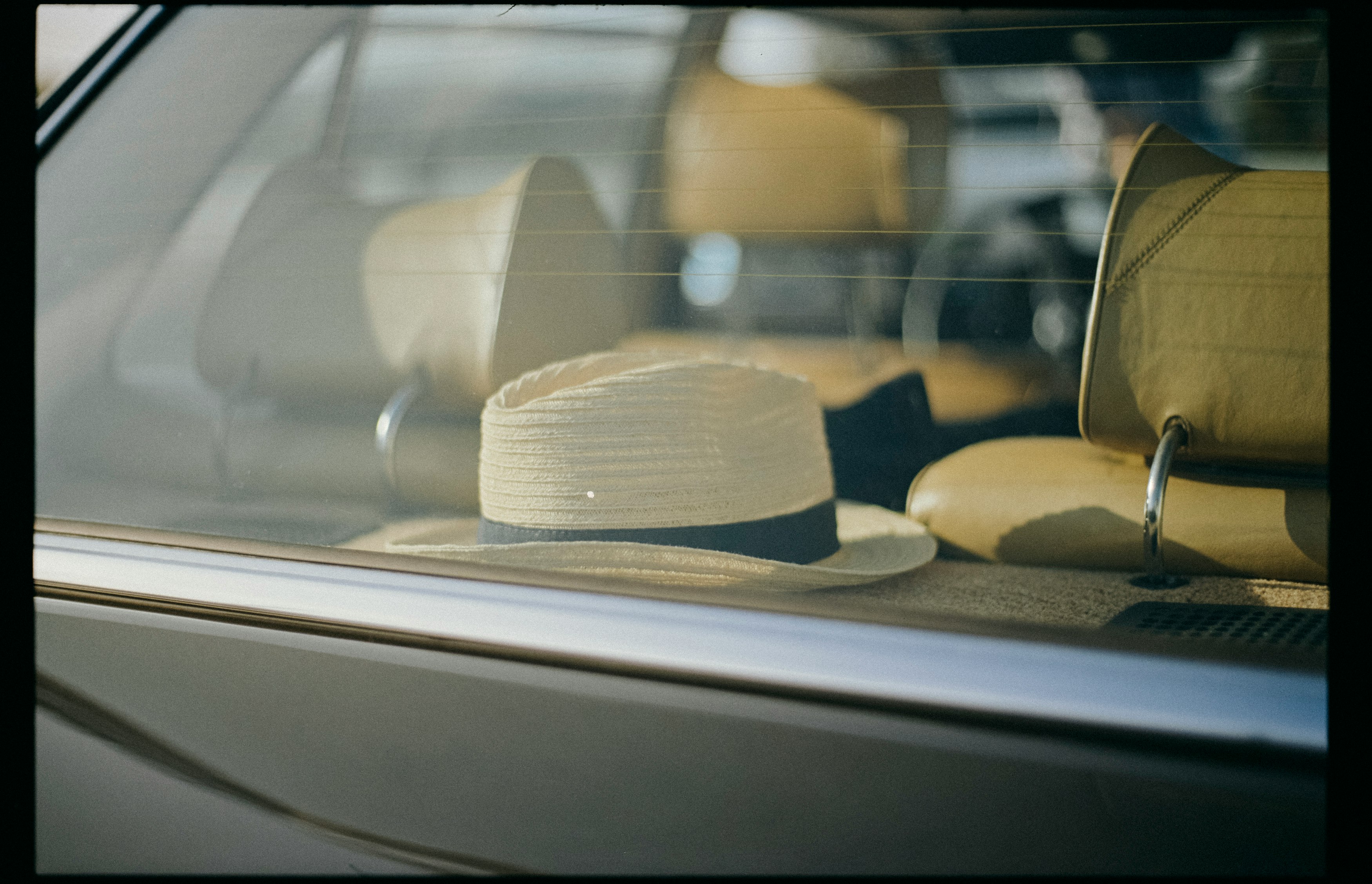 white and brown hat on white table